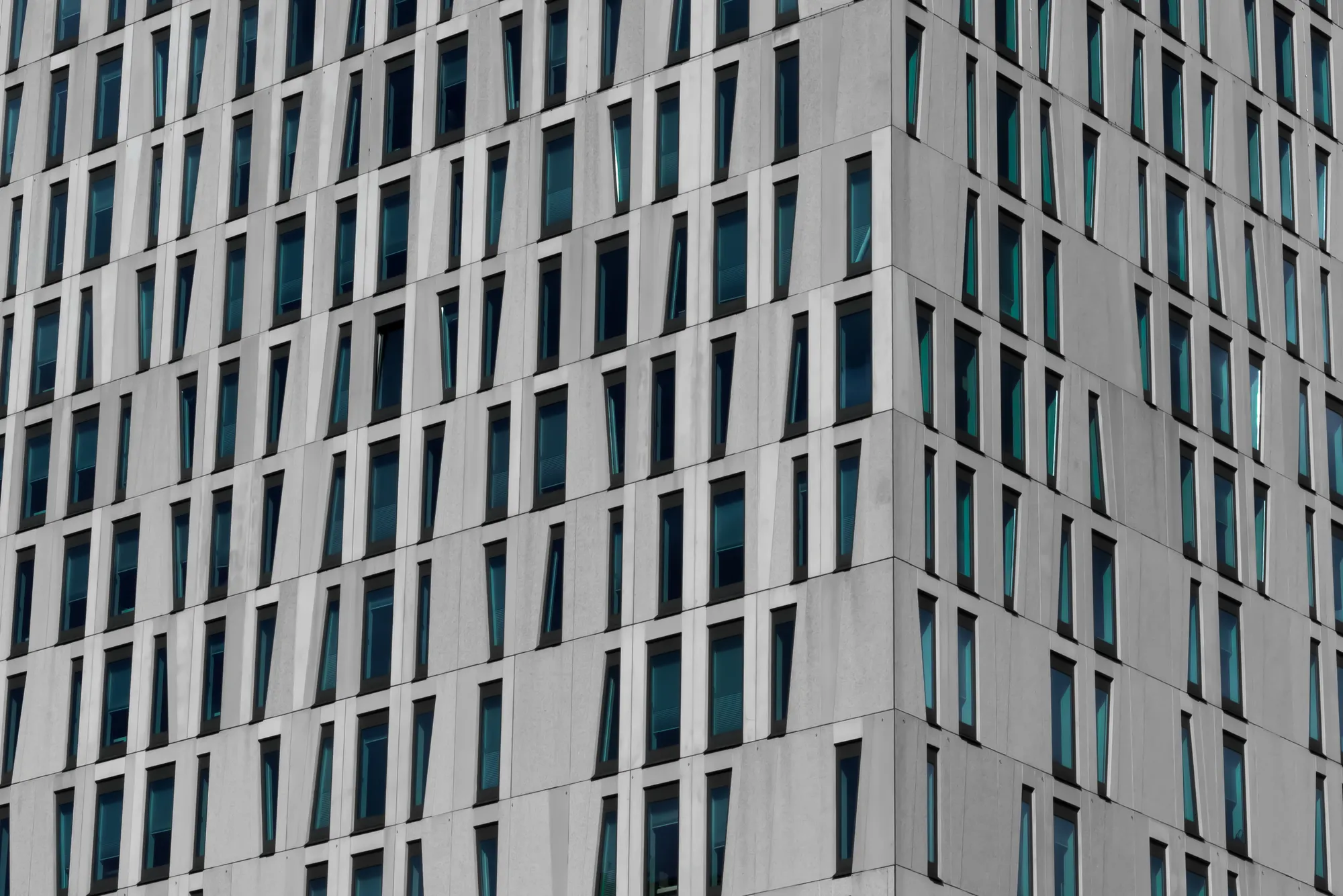 Multi-storey residential building with repeated window openings