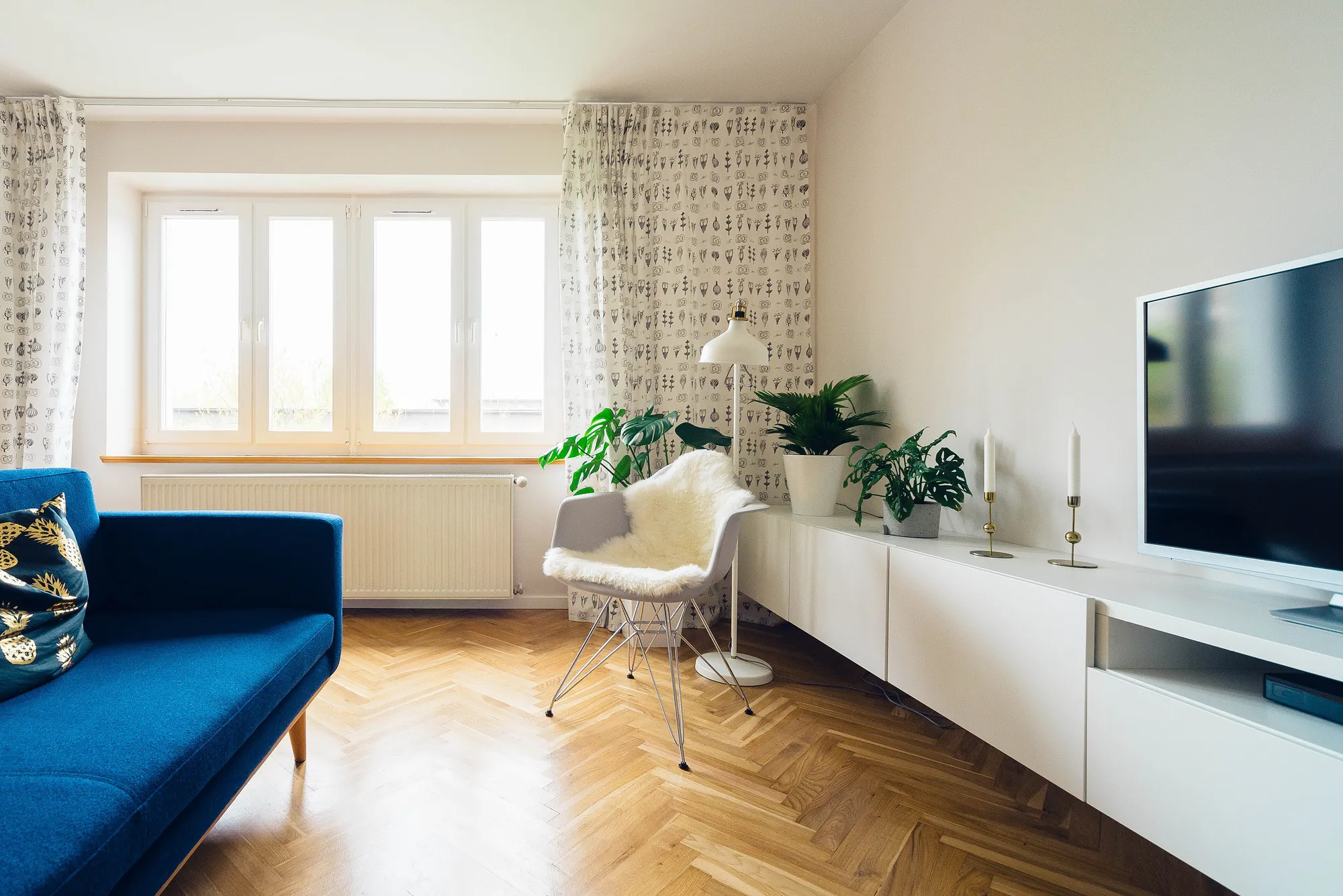 Living room corner with floor-to-ceiling windows