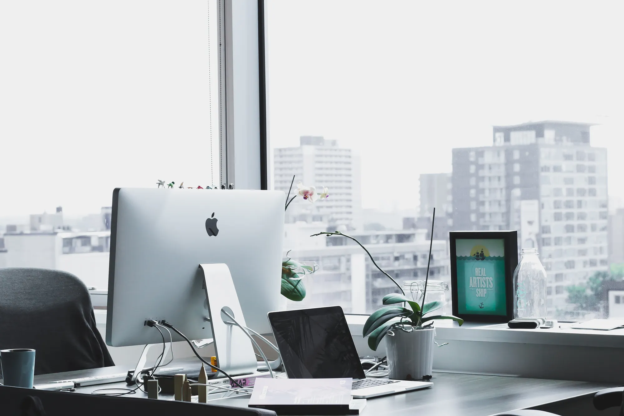Office interior with a long run of interior glass partitions