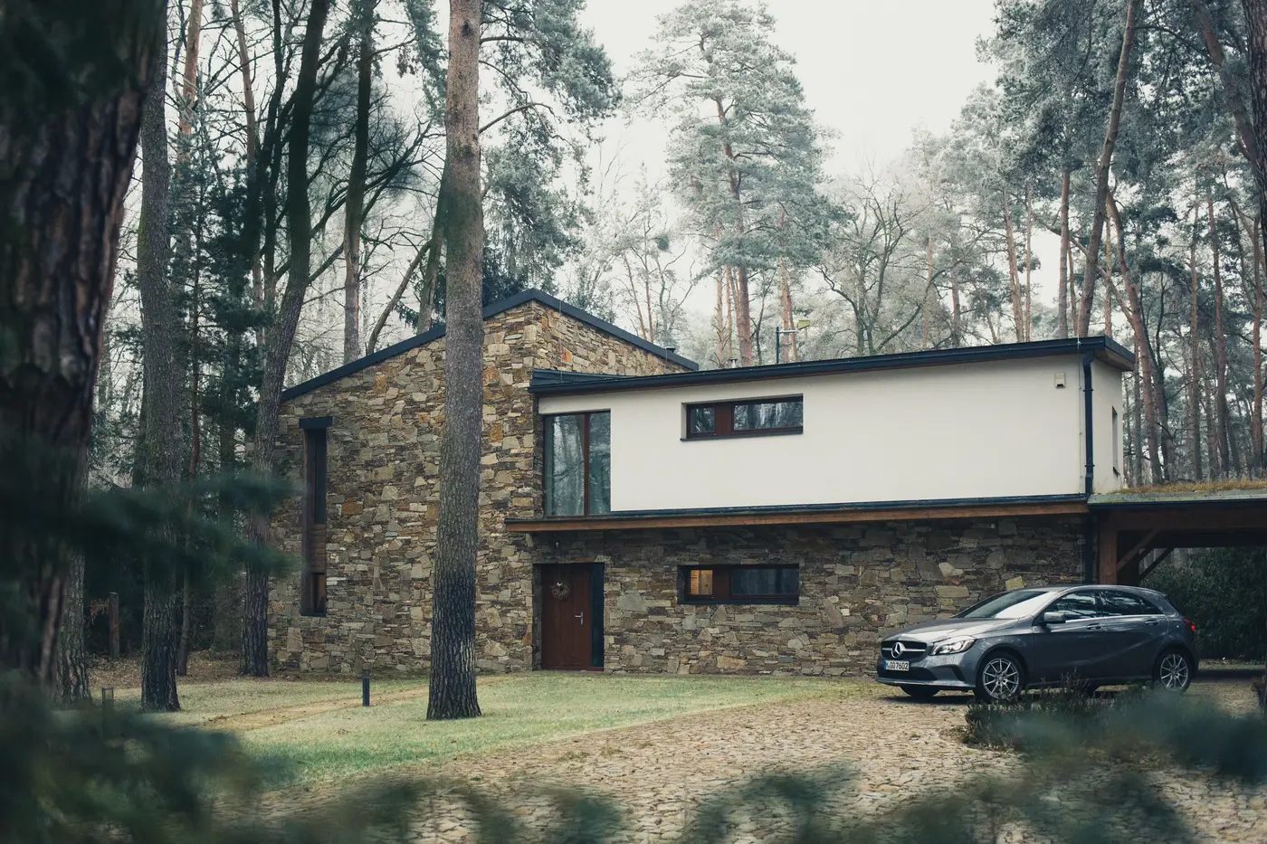 Traditional shingled house with many divided-light windows
